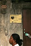 A board with bell-pushes at the door of an apartment house in Habana, Cuba on Tuesday, March 6, 2007.