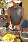 A fisherman cooking a lobster near his house. Surgidero de Batab, Cuba, Thursday, March 8, 2007.