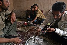 Smoking opium in a private house in the town of Bam, Iran on Thursday, April 27, 2006.The town seriously damaged by an earthquake has become a transit center for drugs supplied from Afghanistan and Pakistan and going further on west. It's no problem to purchase opium in the town. Smoking it is popular with the citizens as an evening relaxation easy of access.