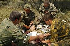 A moment after the bombardment of the convoy by the Georgian aircraft on the road from Tshinvali to Russia. First aid being given to a wounded Russian soldier. Monday August 11, 2008. 