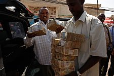 Banknotes are taken off the car for the following change. Hargeisa, SomaliLand, Saturday, September 29, 2007. The largest denomination bank note in the country - 500 shillings - is equal to 8 American cents. Besides it 100 and 50 shilling banknotes are in circulation as well.